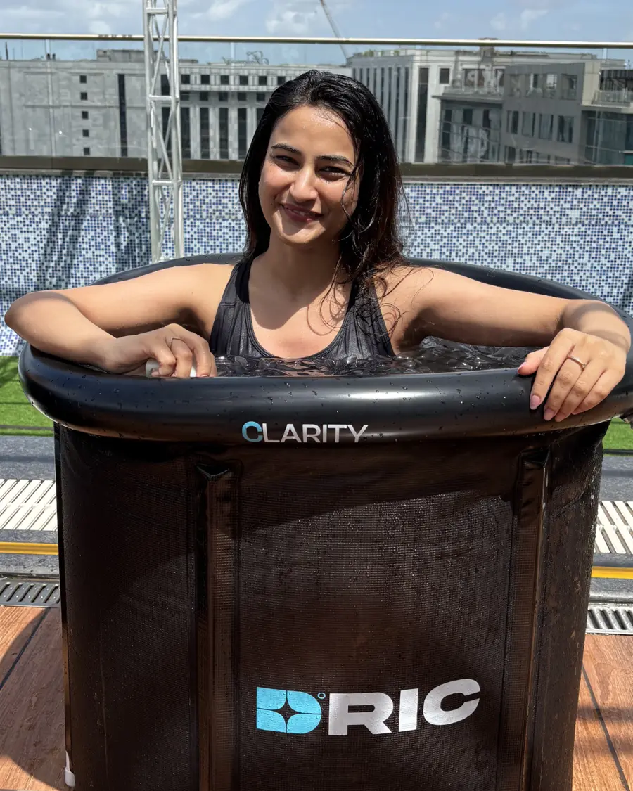 A participant smiling in an ice bath